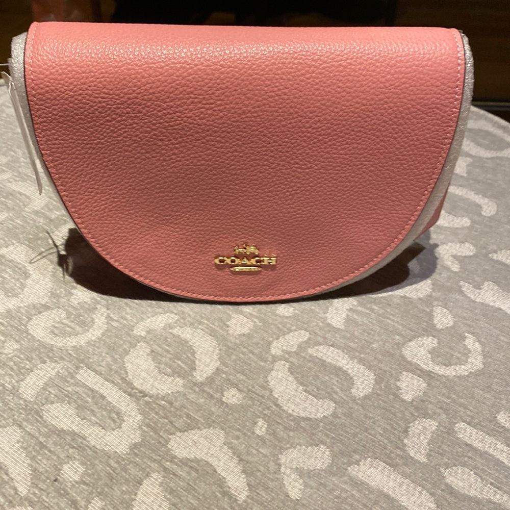 Coach crossbody bag with detachable strap. Color: Bubblegum